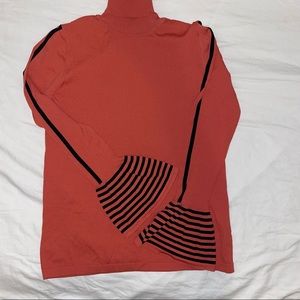 Woman’s orange turtleneck ADL size medium